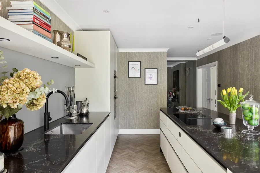 Ultra-compact black kitchen worktop in contemporary Cotswold kitchen